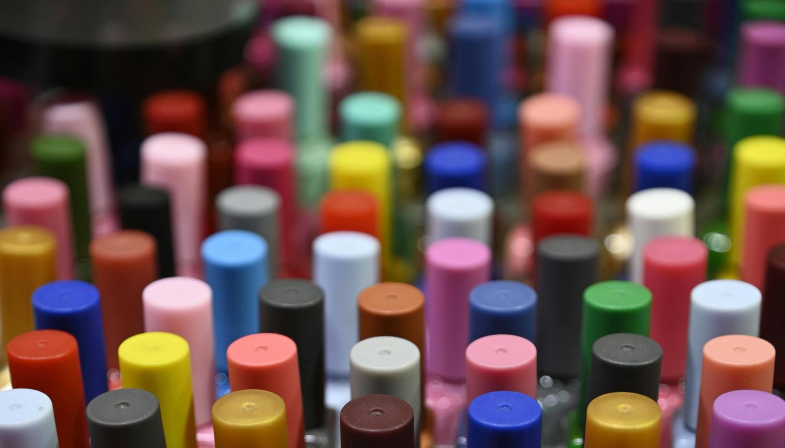 a wall of hundreds of nail-polish bottles